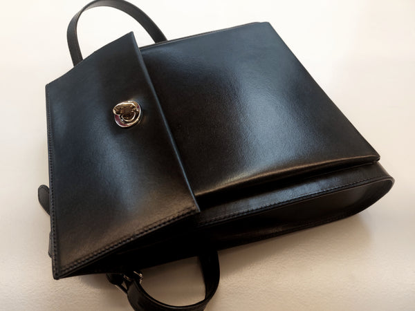 Black handbag, the Seed Satchel