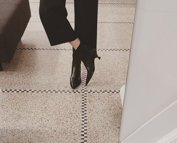 Black booties on low heel