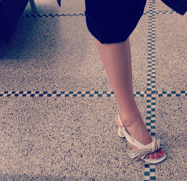 White sandals with fringe