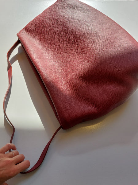 Asymmetrical big handbag in earth red