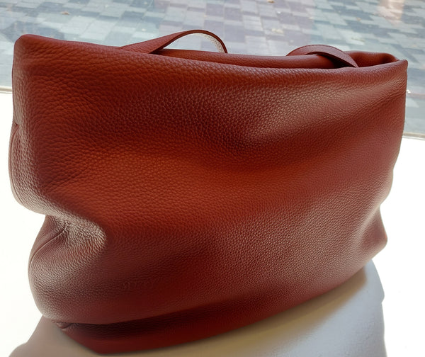 Asymmetrical big handbag in earth red
