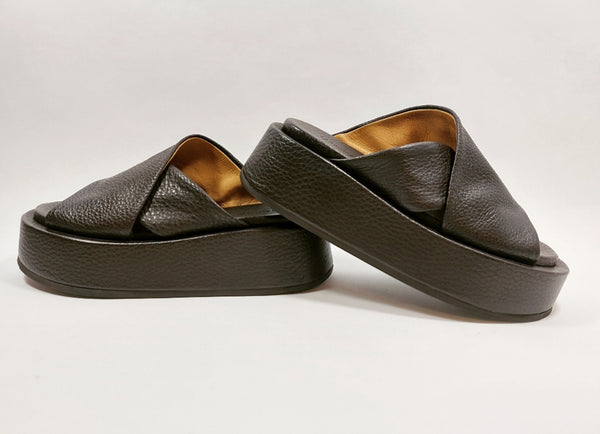 Brown cross straps mules on a platform sole