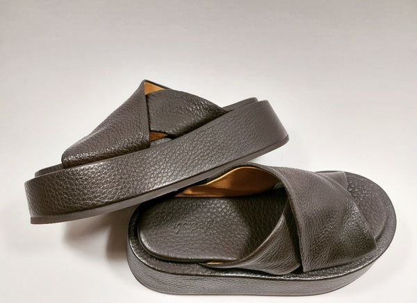 Brown cross straps mules on a platform sole