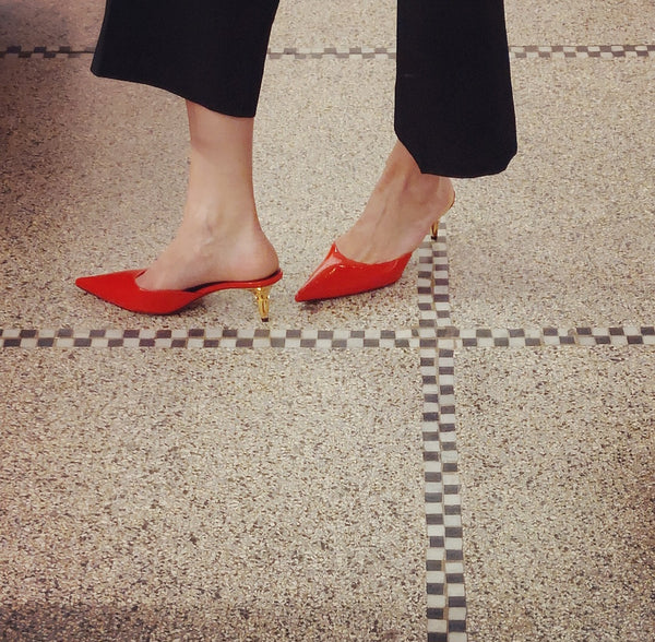 Mules in red on spike heel